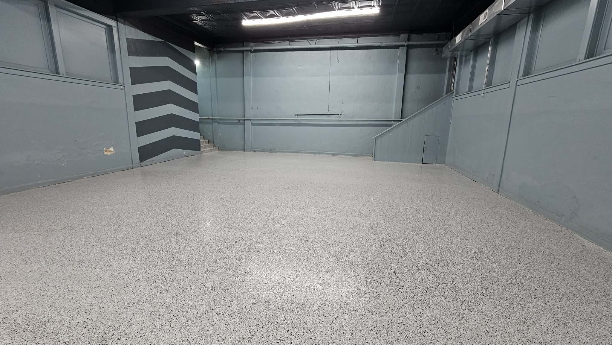 Finished gray flake floor in the fellowship hall and gym at Central Baptist Church in Kansas City