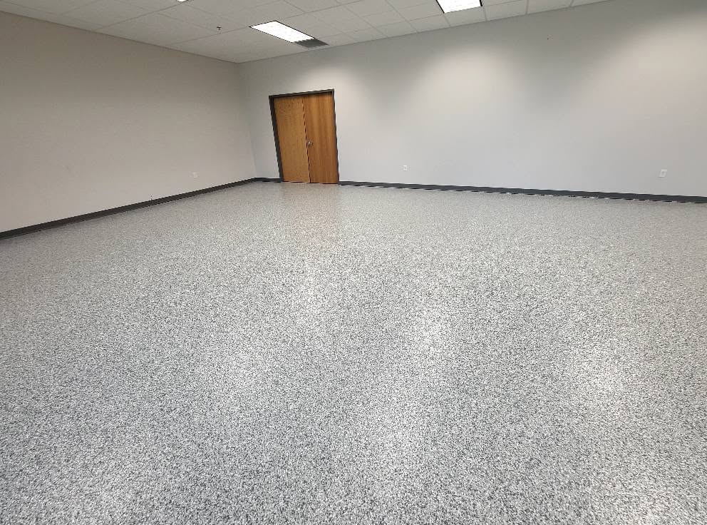 Commercial flake epoxy floor in the showroom at Butler Supply Lenexa KS with coved base