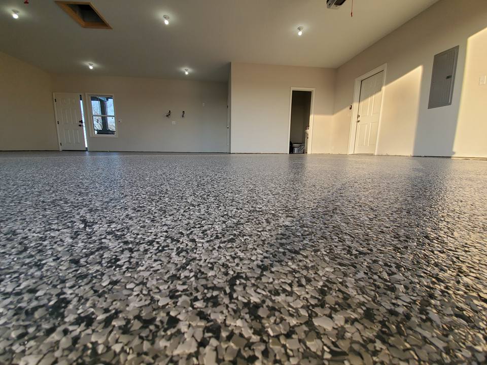 Close-up of full-broadcast flake epoxy texture on a Kansas City garage floor